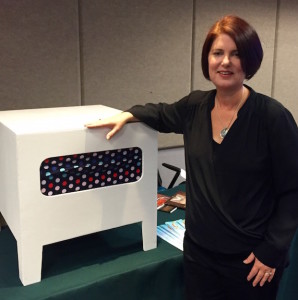 Kelley Styring and the box used in her experiment.