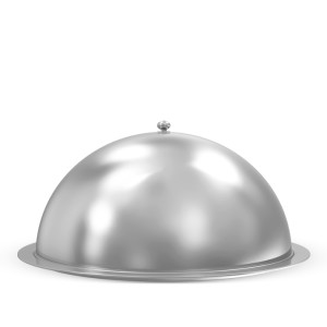 A large, silver platter covered by a domed lid.
